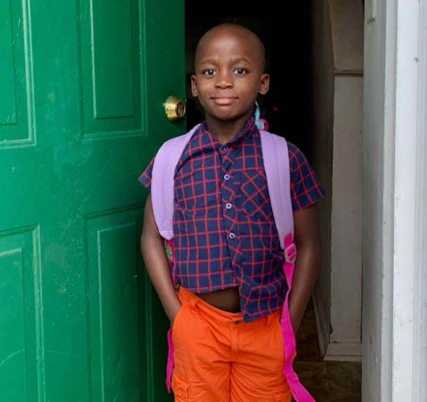 Young boy in doorway entrance